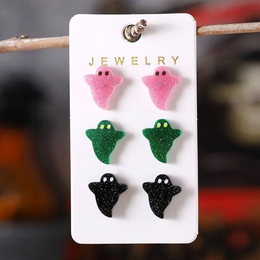 Halloween cute colorful ghost earrings set with pink, green, and black acrylic designs on a jewelry display card.