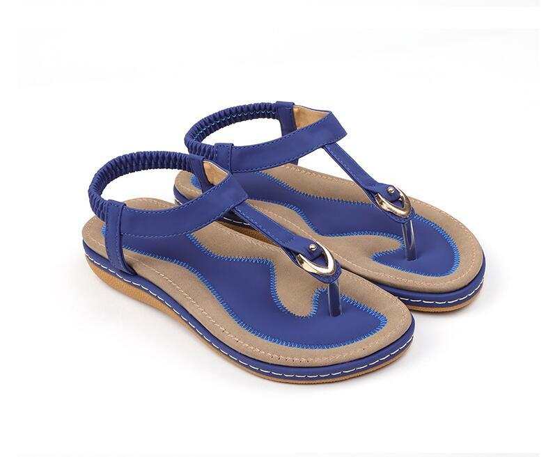 Fashionable women's summer sandals with blue ankle strap and low platform heel.