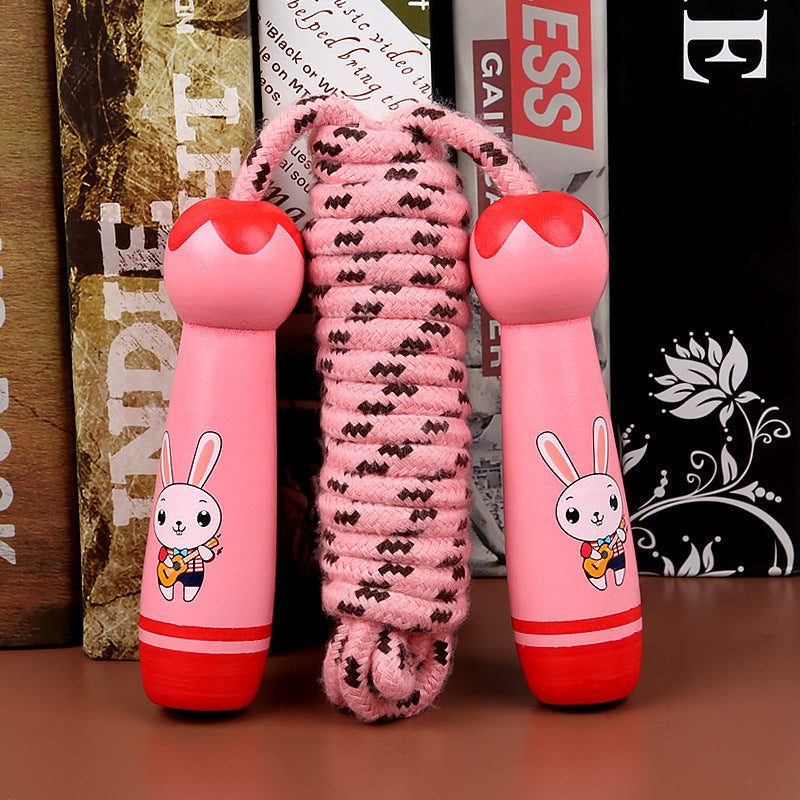 Wooden children skipping rope with pink handles featuring a cute rabbit design for exercise and fitness.