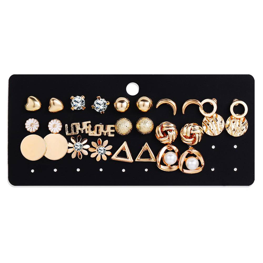 Beautiful rhinestone earrings set with various designs on display card.