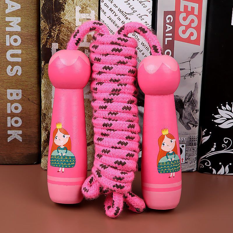 Wooden children's skipping rope with pink handles for exercise and fitness.