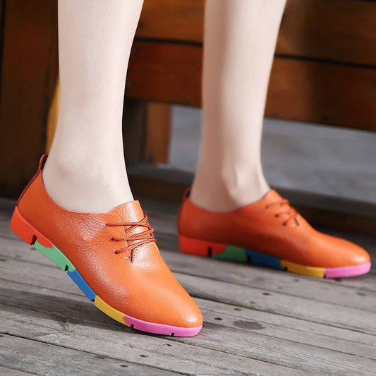 Stylish women's orange casual nurse shoes with colorful rubber soles.