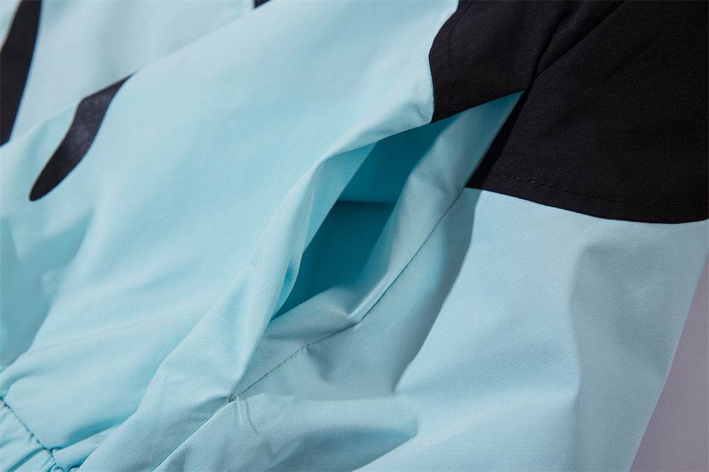 Blue sun-protective men's wind coat with polyester fiber lining close-up.