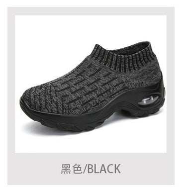 Black women sporting shoes with a knitted design and cushioned sole.