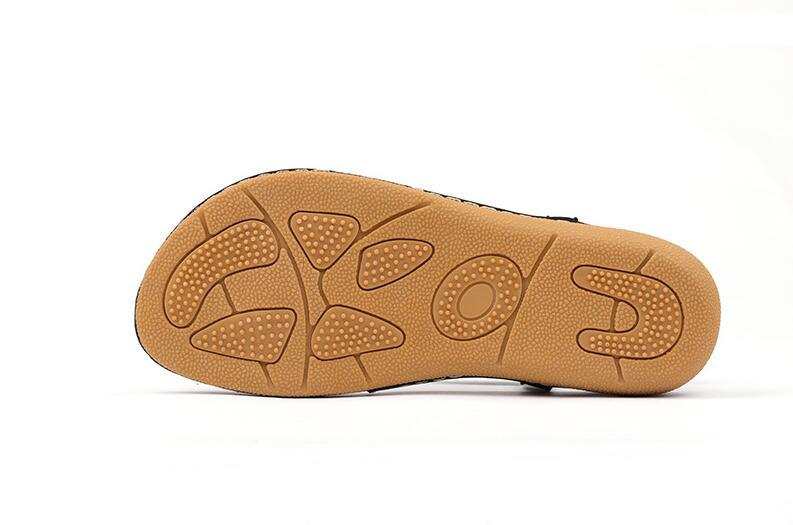 Rubber outsole of women's summer sandal with traction pattern.