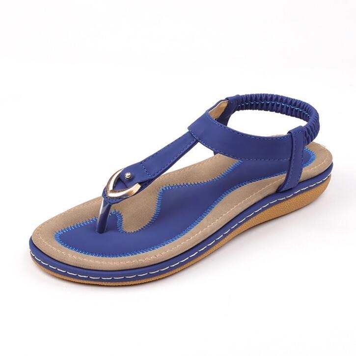 Women's fashion sandal with ankle strap, low heel, rubber outsole, blue PU material.