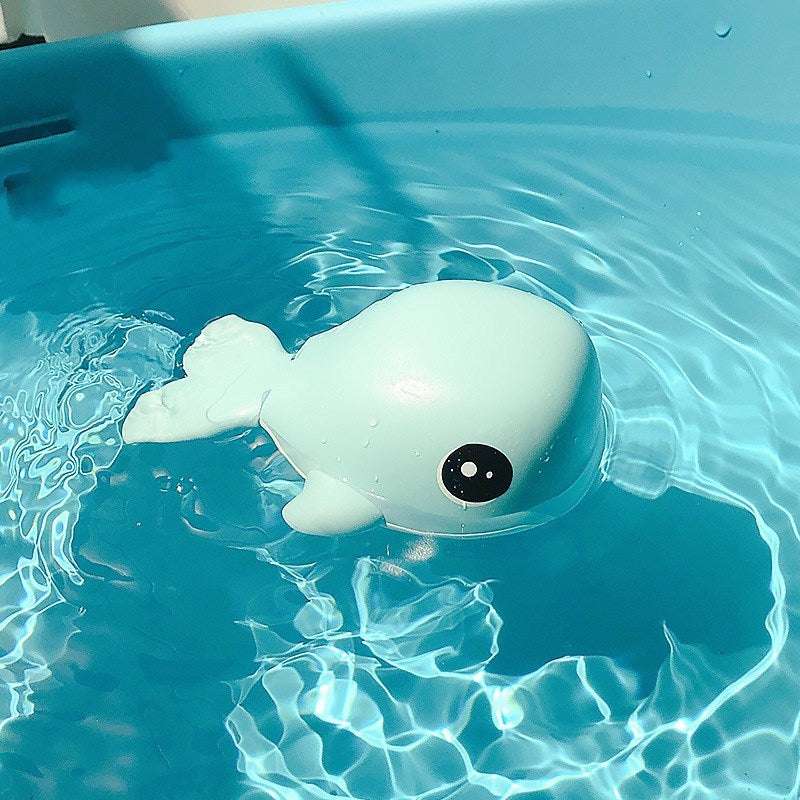 Cognitive floating whale toy for children bathing.