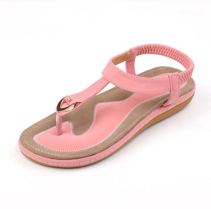 Fashionable women's summer sandal with low heel and ankle strap.