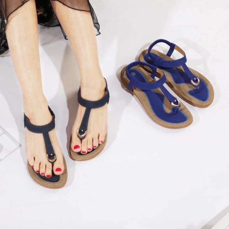 Fashionable women's summer sandals with ankle straps and low heels.