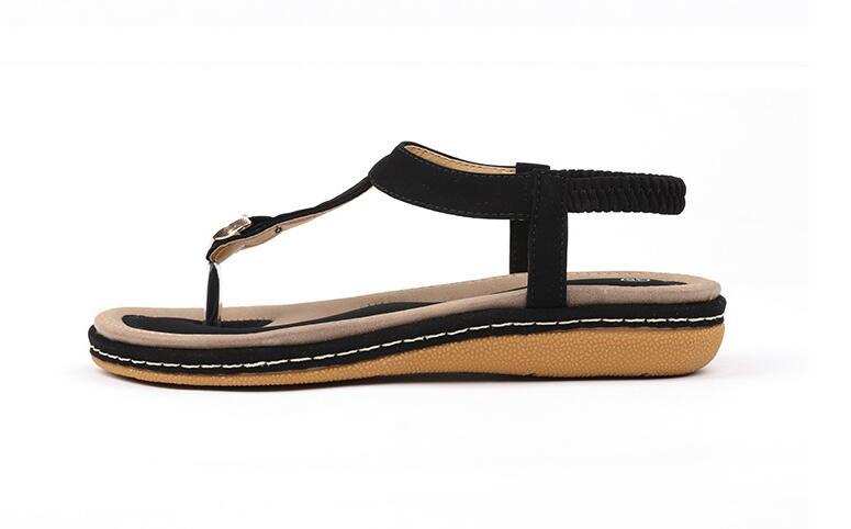 Fashionable summer women's sandal with ankle strap, low heel, and rubber outsole.